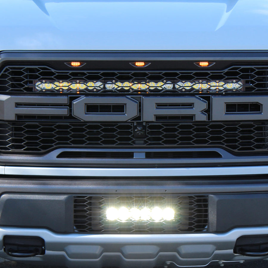 Barra de luz LED Baja Designs Ford OnX6+ 10 Inch Grille Lower Light Bar Kit - Ford 2017-20 F-150; NOTE: Raptor (Light Pattern: Driving/Combo, Color: Clear)