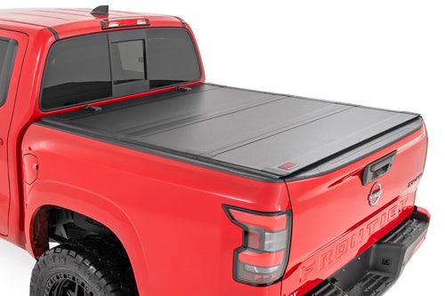 Tapa de Caja Tri-Fold Plegable para Nissan Frontier (22-26)